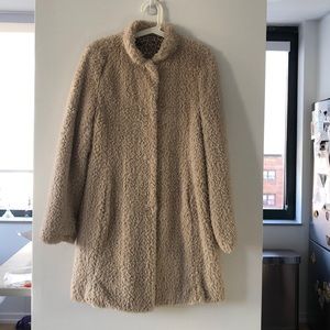 Cream teddy coat with leopard lining.